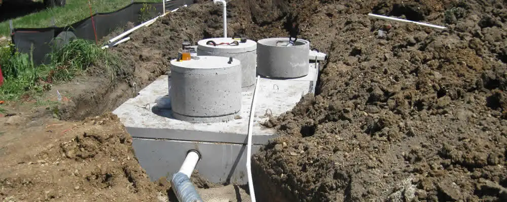 Septic system repair and installation site with tank access ports in Escondido, CA