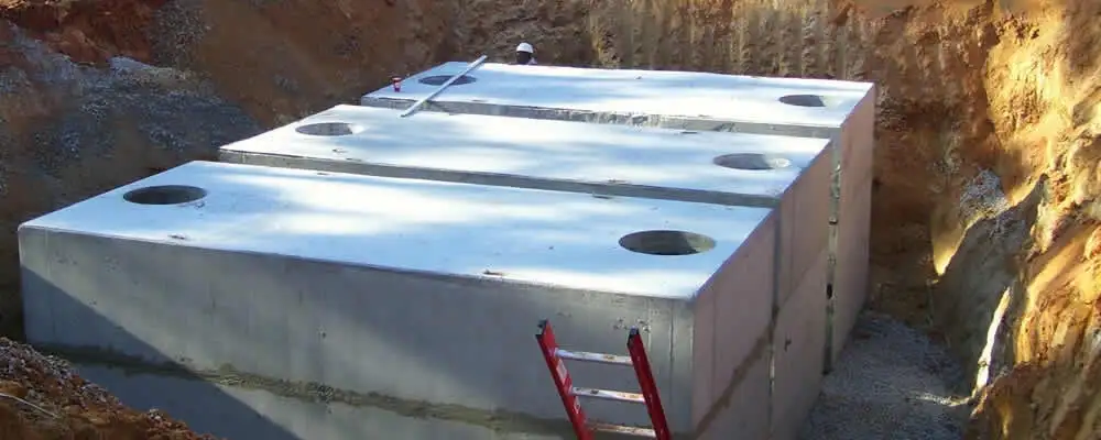 Septic tank installation site with a newly placed concrete tank in Escondido, CA